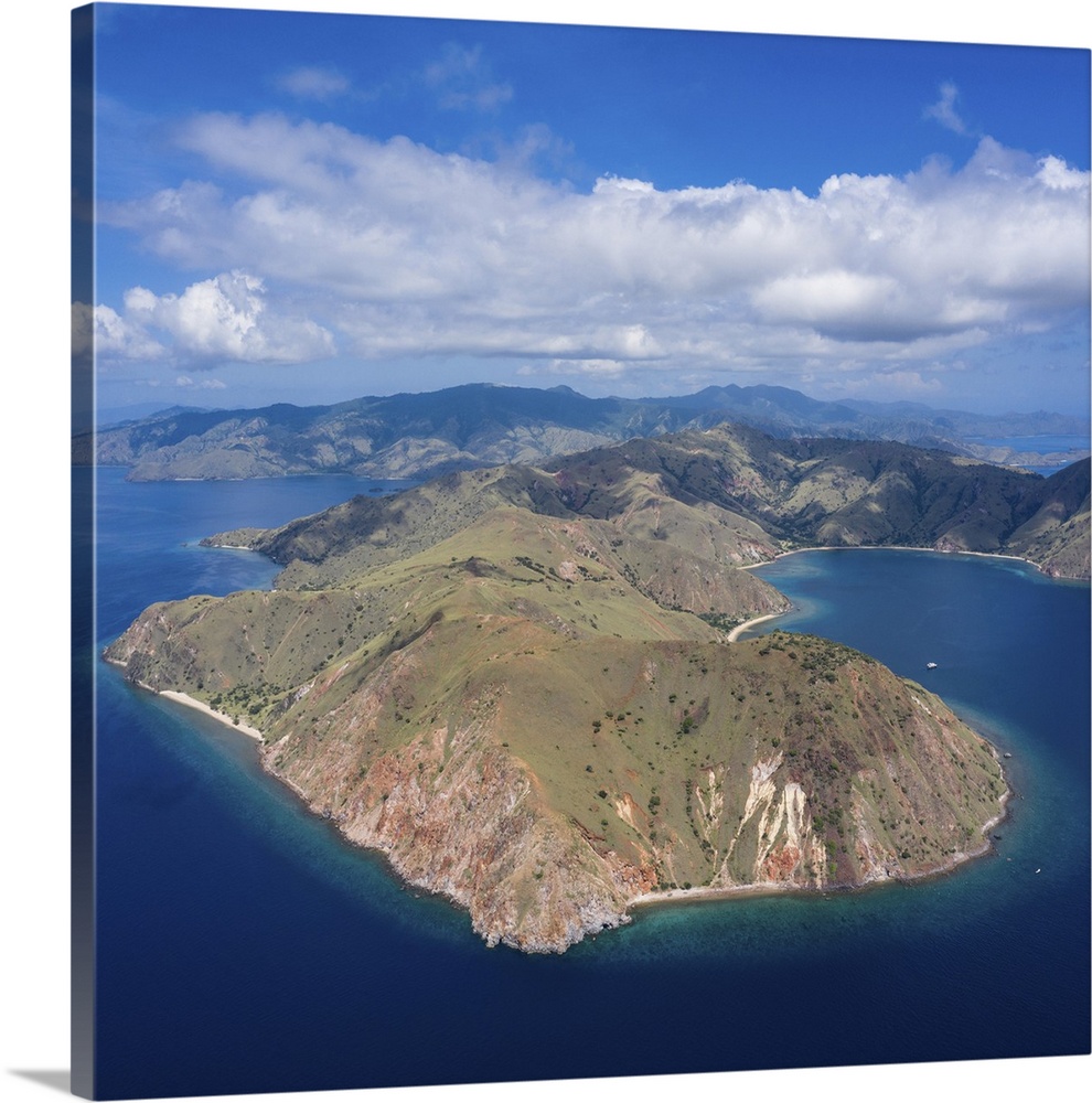 Bird's eye view of an idyllic island and fringing reef in Komodo National Park, Indonesia.