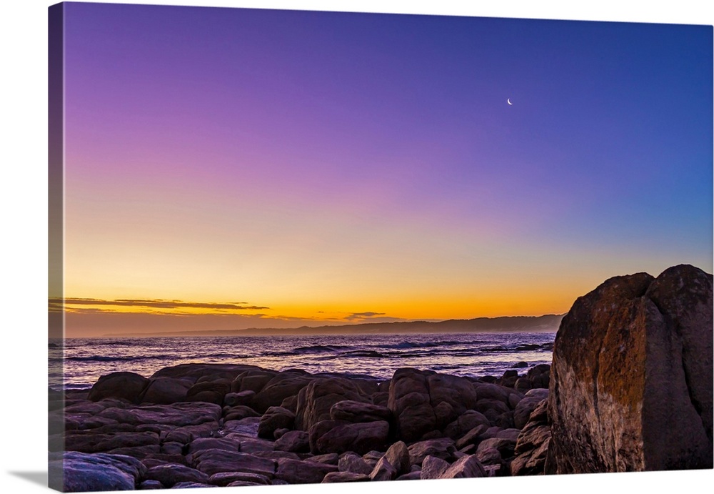 Waxing crescent moon in evening twilight at Cape Conran, Australia.