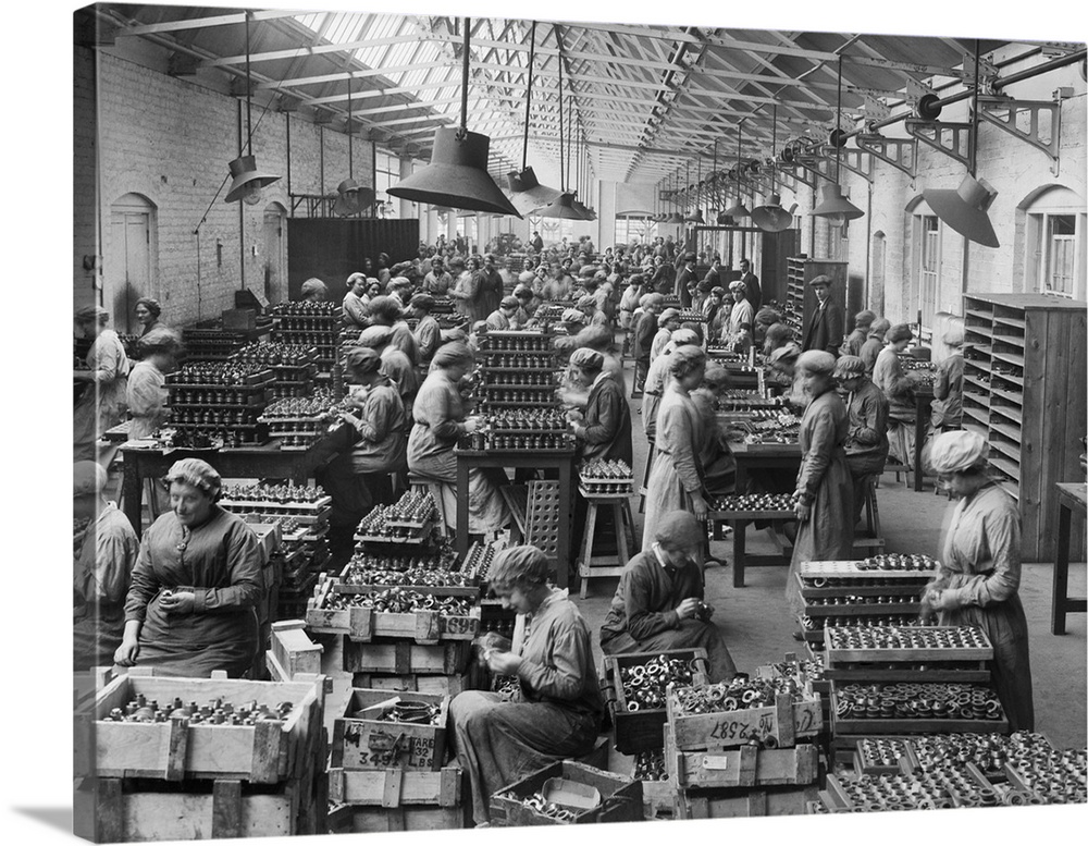 Women at work during the First World War, arranging fuse-heads at one of the gun factories, possibly the Coventry Ordnance...