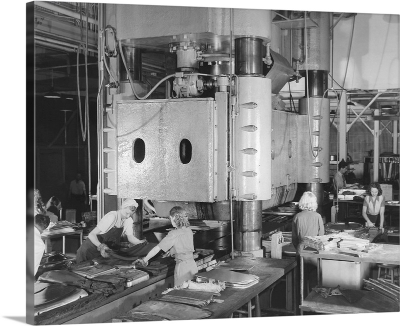 Women working heavy machinery at an aircraft assembly plant, circa 1942