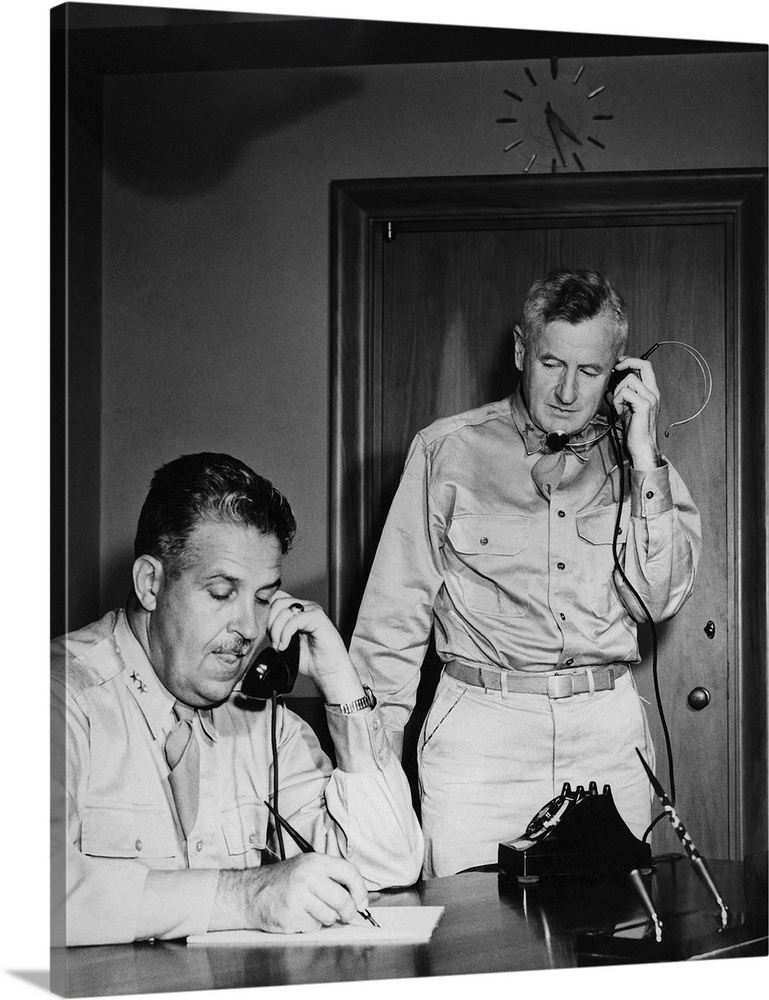 World War II photograph of General Leslie Groves and General Thomas F. Farrell at work, 1945.