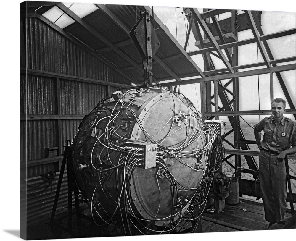 World War II photograph of the Trinity Test bomb partially assembled on the test tower.
