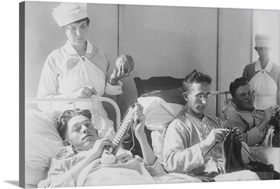 Wounded soldiers knitting under the watchful eye of nurses