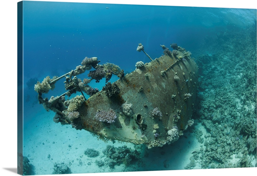 Wreck of sailing boat after taking the ground on a coral reef, Red Sea, Egypt.