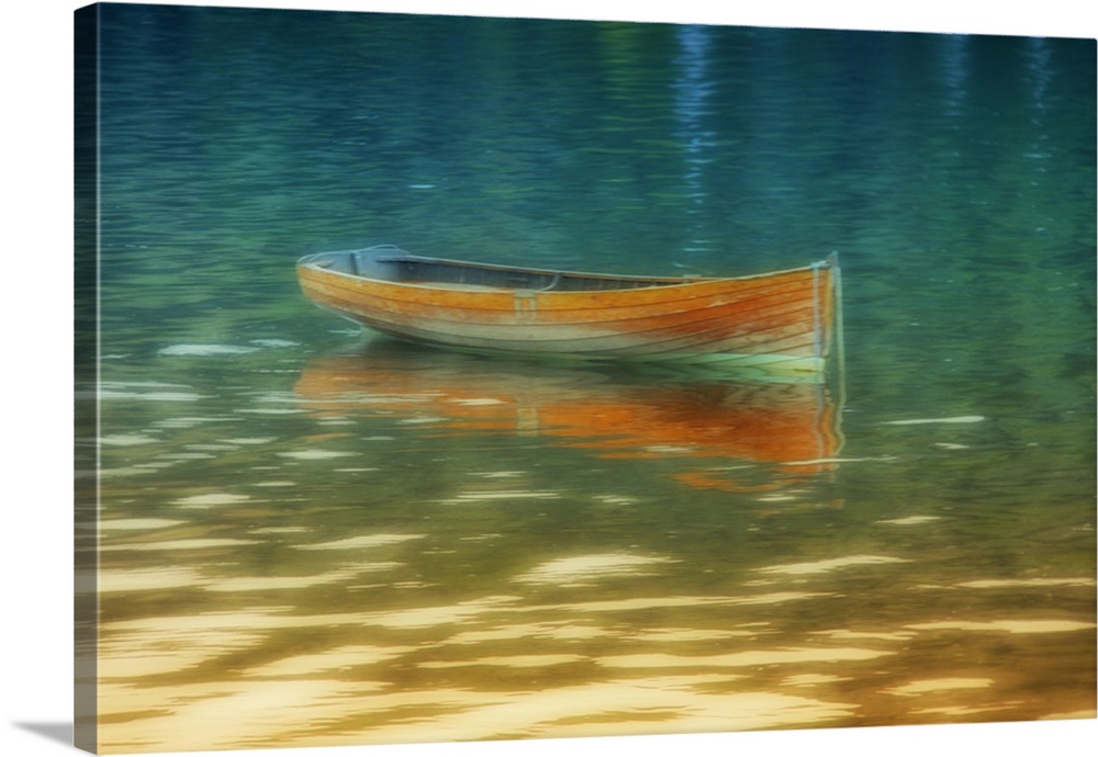 A bright orange boat floating on golden water.