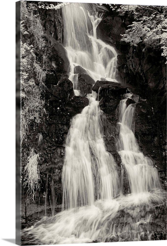 Black and white photograph of a waterfall in Scotland.