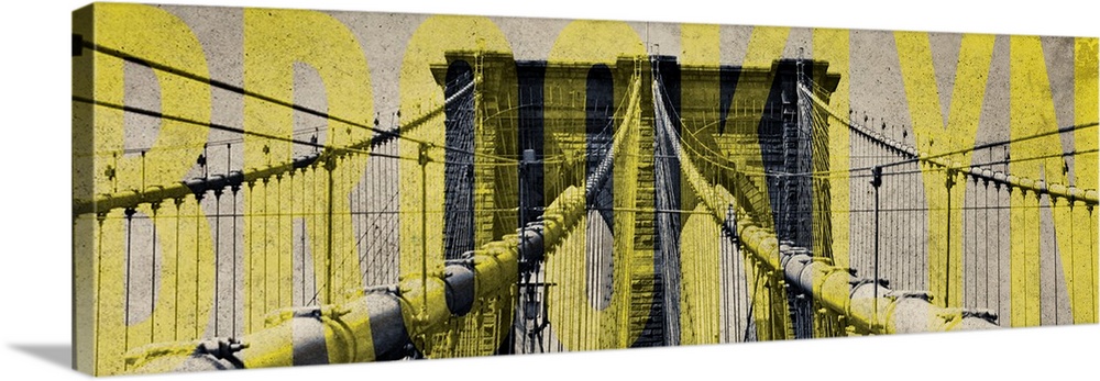 One of the towers of the Brooklyn Bridge with "Brooklyn" in yellow lettering.