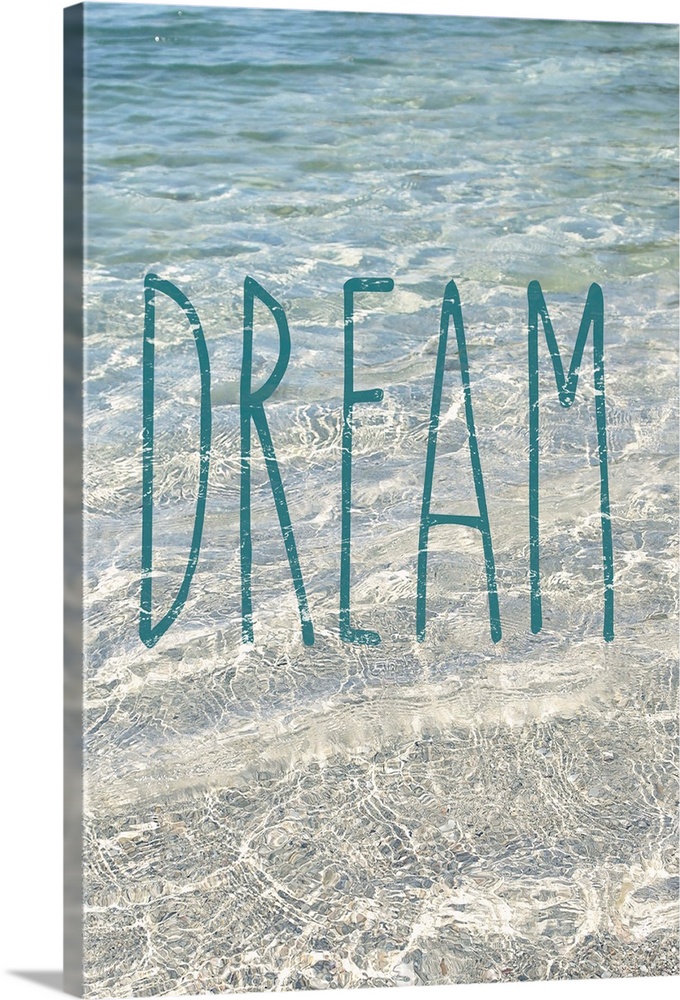"Dream" written in blue on top of a photograph of crystal clear ocean water.