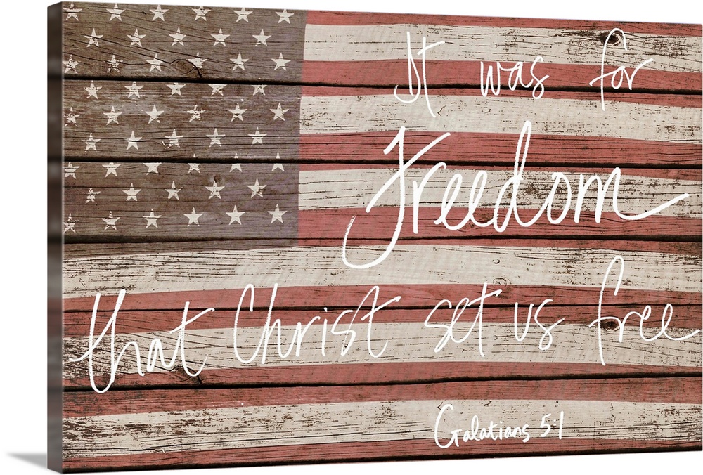American flag on wooden board with a bible verse handwritten over it.