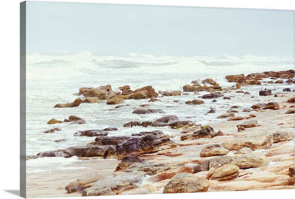 A photograph of a rocky beach shore.