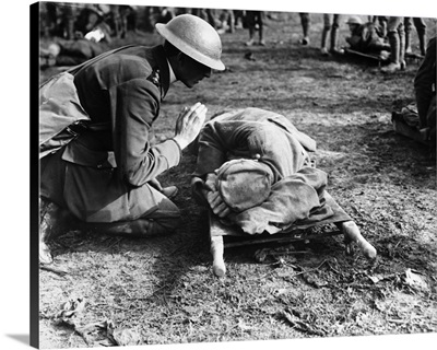 A British priest saying a prayer over a German soldier during World War I