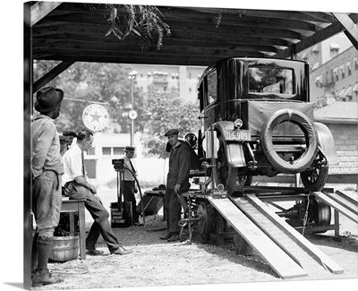 A car being inspected at an American gas station, 1924
