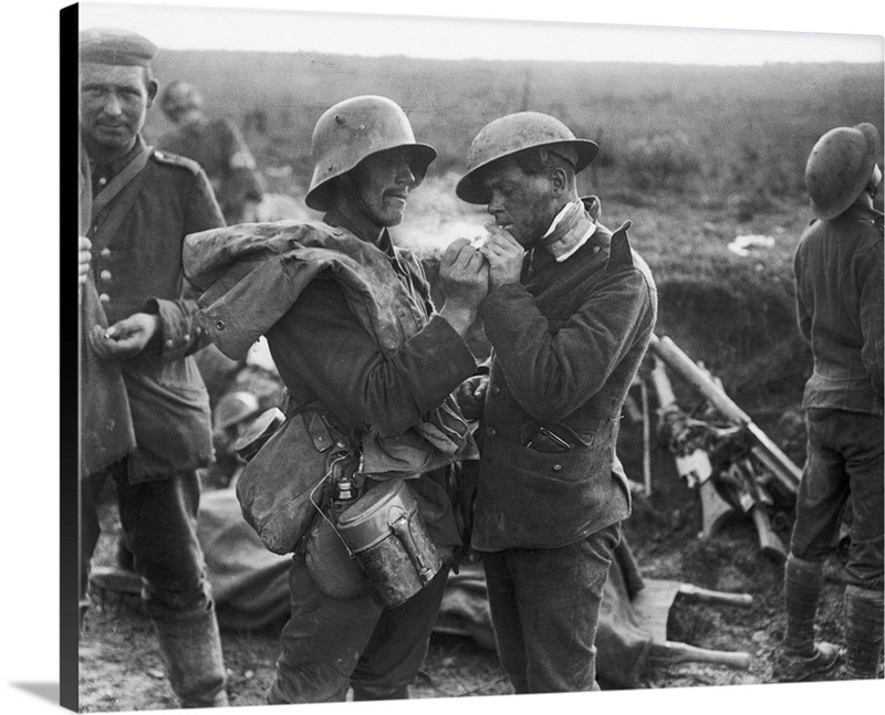 A German soldier lights the cigarette of a British soldier, Battle of ...