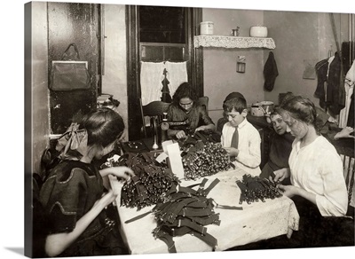 A Jewish family making garters in their tenement home in New York City, 1912