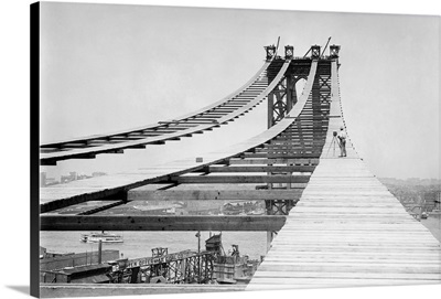 A photographer on the temporary foot path atop the Manhattan Bridge, 1908