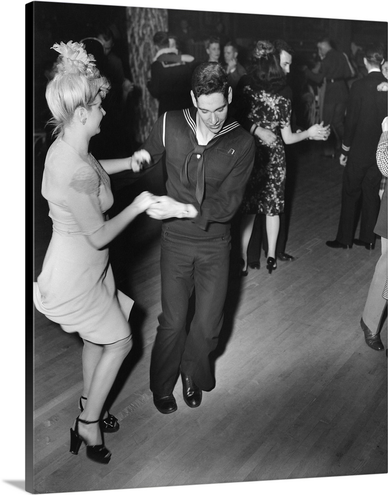 A sailor and his girlfriend dance the Jitterbug at the Hurricane dancehall in New York City. Photograph by Gordon Parks, A...