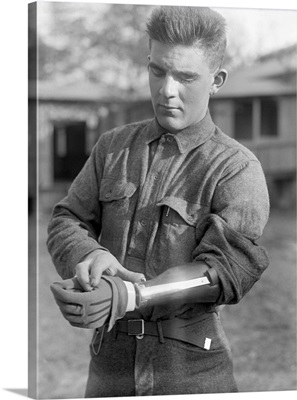 A veteran of World War I wearing a prosthetic arm, 1917