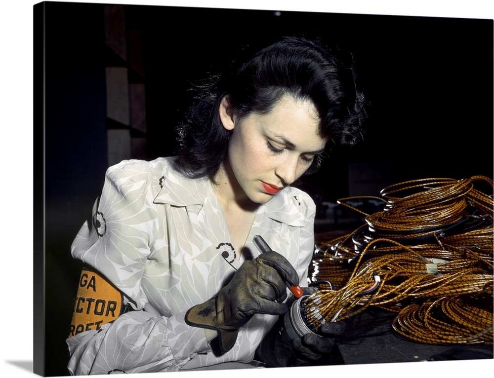 A woman working at the Vega Aircraft Corporation plant in Burbank, California. Photograph by David Bransby, June 1942.