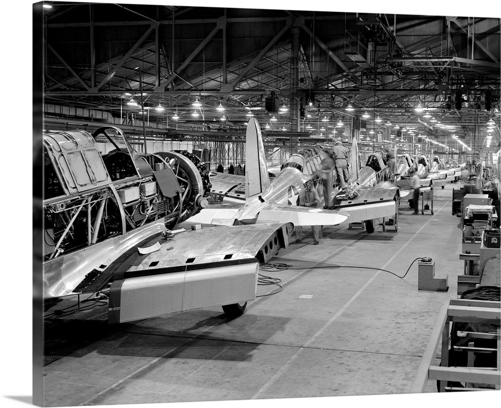 Assembly line production of BT-13A Valiant basic trainer aircraft at a Vultee factory in Downey, California, during World ...