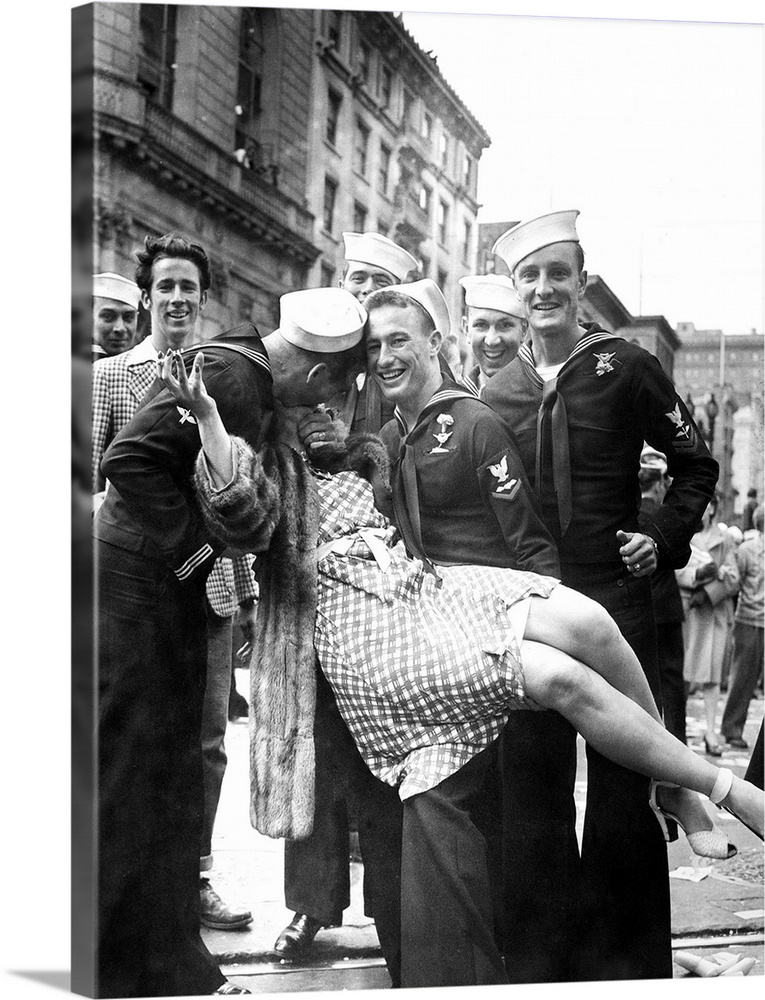 American sailors kissing and posing with a woman while celebrating the end of World War II, possibly in Times Square, New ...