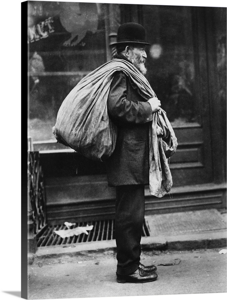 An old man who buys old clothes in New York City. Photograph, c1910.