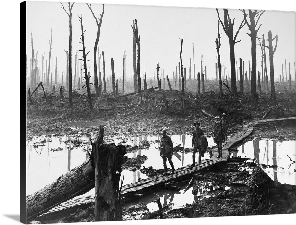 Australian troops walking along duckboards through the remains of Chateau Wood, during the Battle of Passchendaele in Belg...