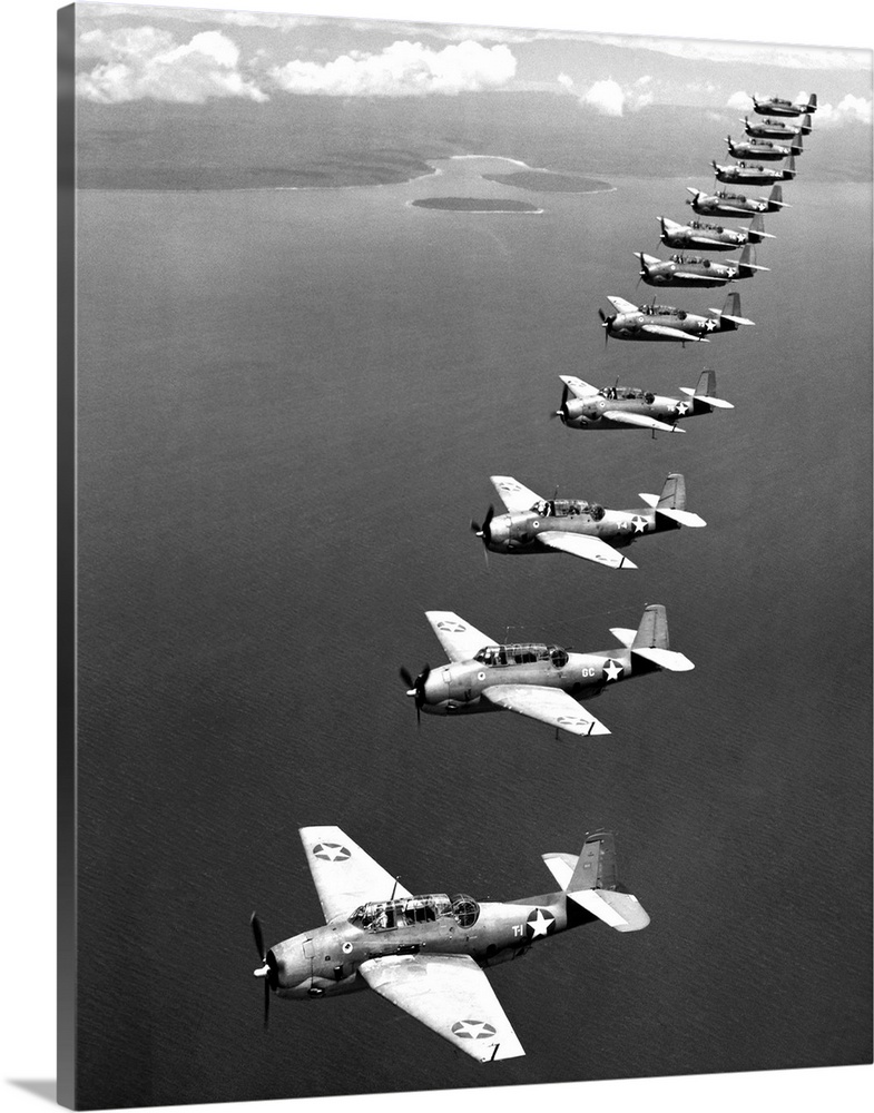 A flight of twelve Grumman 'Avenger' torpedo-bombers over the South Pacific, 1943, during World War II.