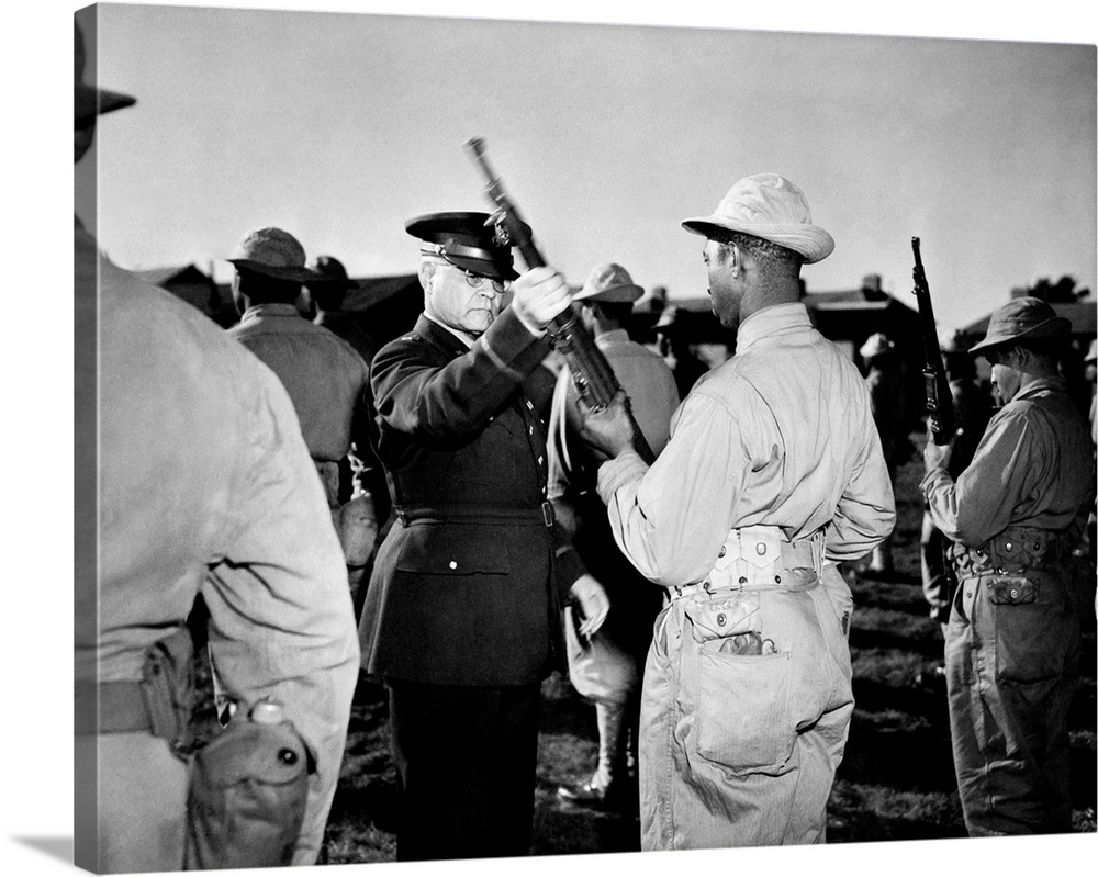 BENJAMIN O. DAVIS, SR. (1880-1970). U.S. Army officer. Brigadier General Davis inspecting an African American soldier's ri...
