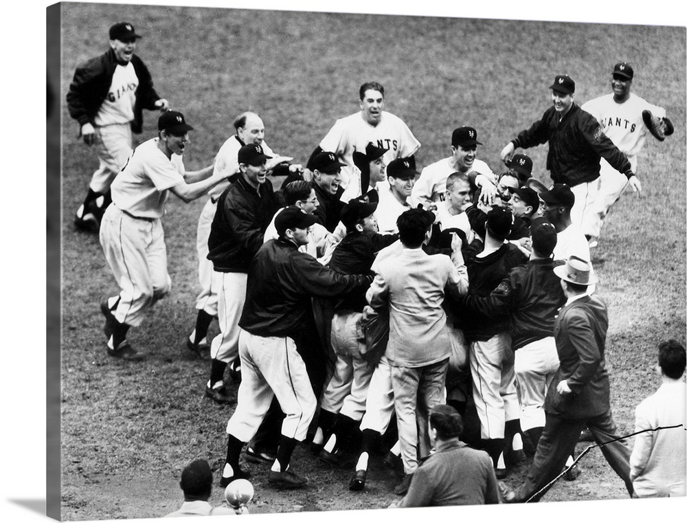 Bobby Thomson of the New York Giants being mobbed by teammates and fans after hitting his pennant-winning home run, the so...