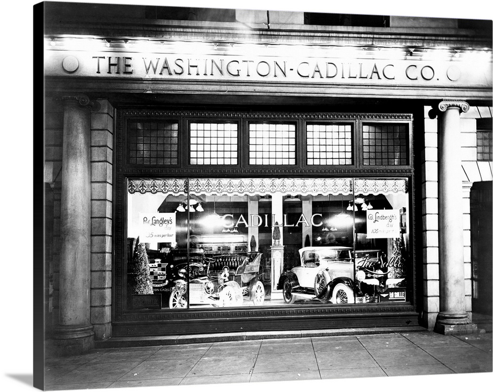 Cadillac automobiles in a store window in Washington, D.C., 1927.