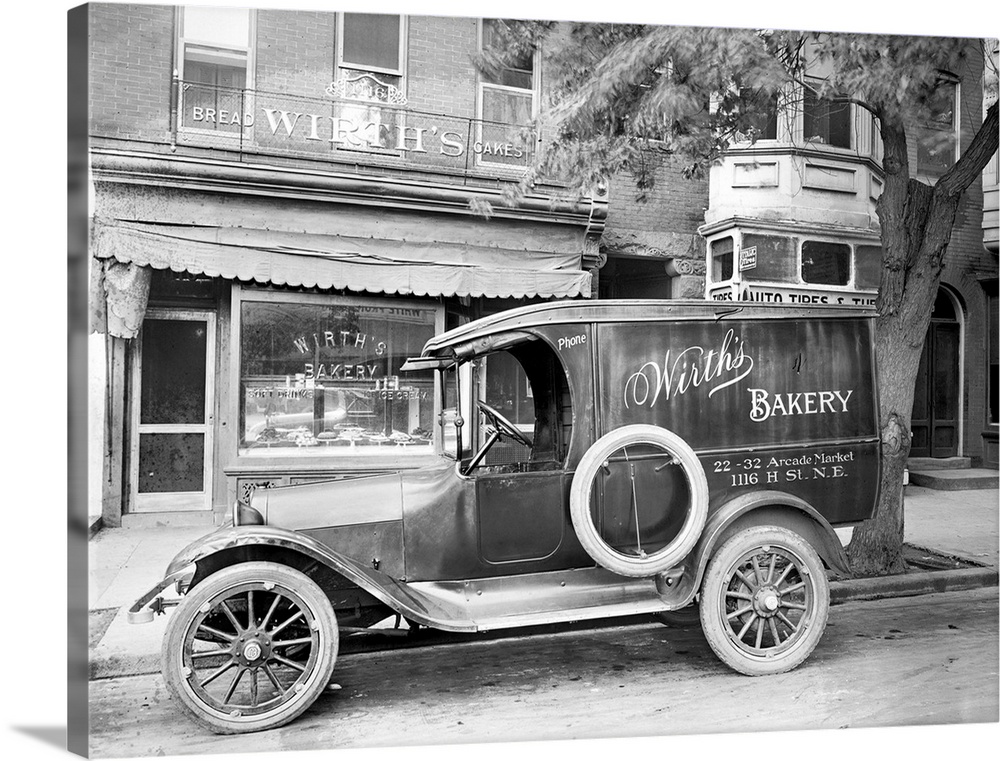 A car with an advertisement for Wirth's Bakery in front of the store on H Street in Washington, D.C., c1915.