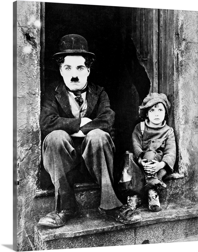 Charlie Chaplin and Jackie Coogan as his adopted son in Chaplin's film 'The Kid,' 1921.