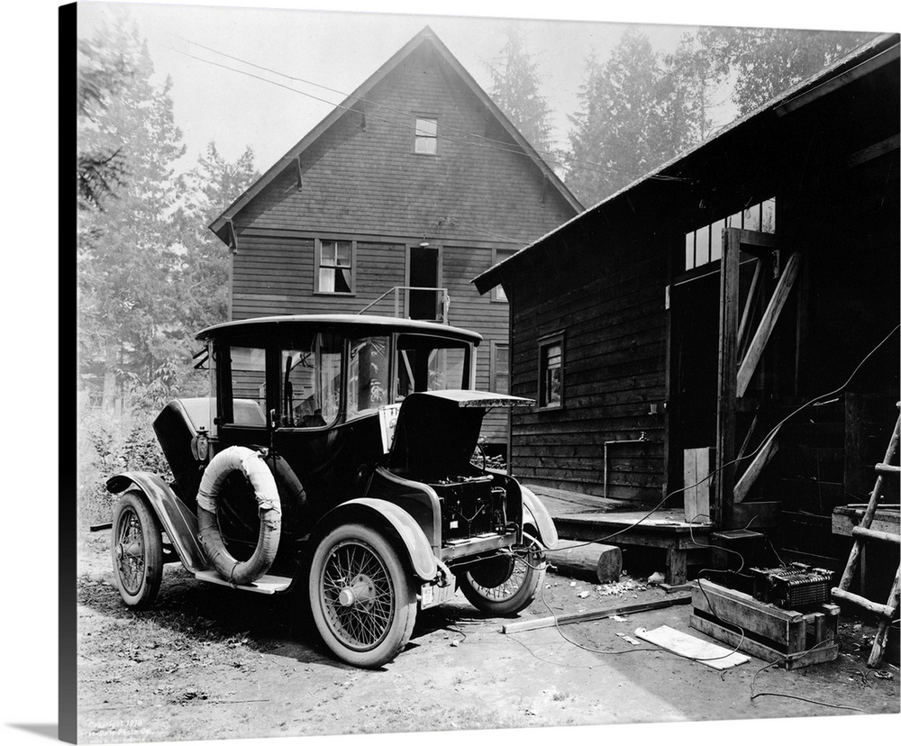 Charging the battery of a Detroit Electric automobile. Photograph, c1919.