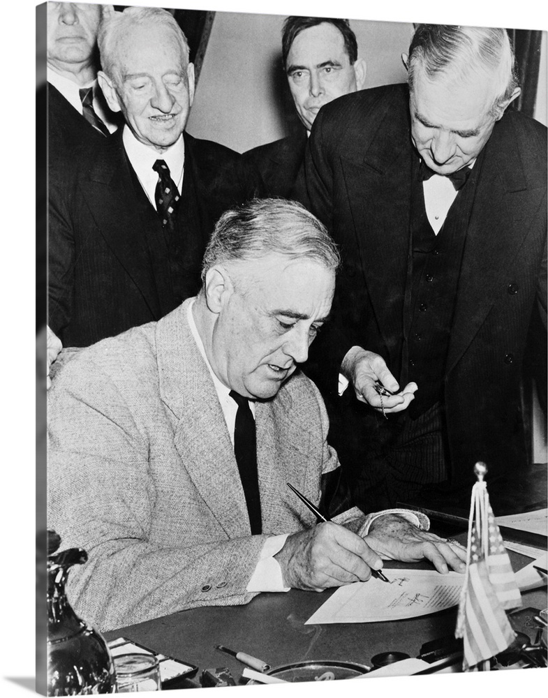President Franklin D. Roosevelt signing the Declaration of War against Germany, December 1941.