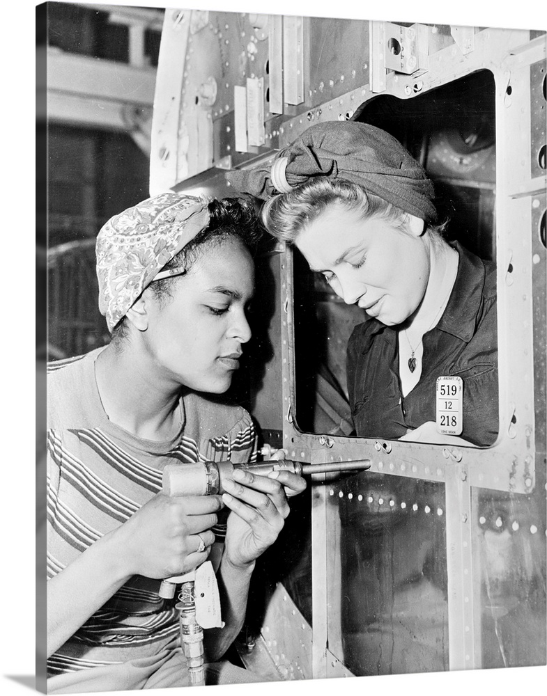 Two women at work at the Douglas Aircraft Company factory in California, during World War II.