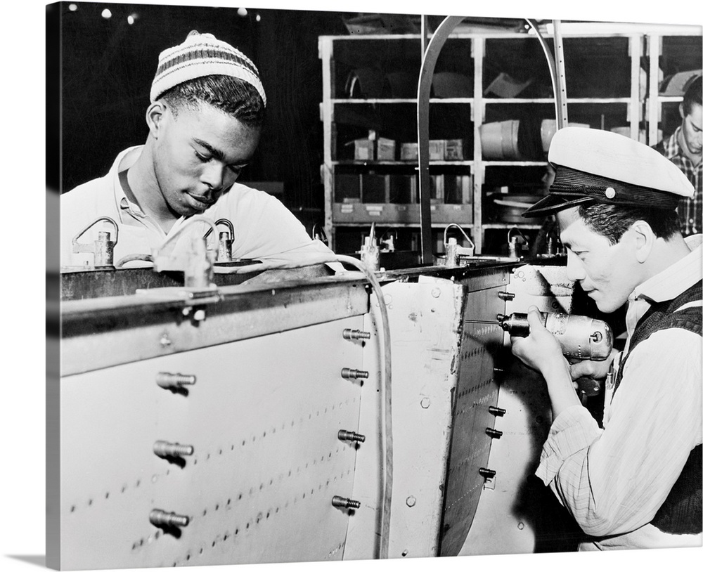 An African-American man and an Asian-American man at work at the Douglas Aircraft Company factory in Los Angeles, Californ...