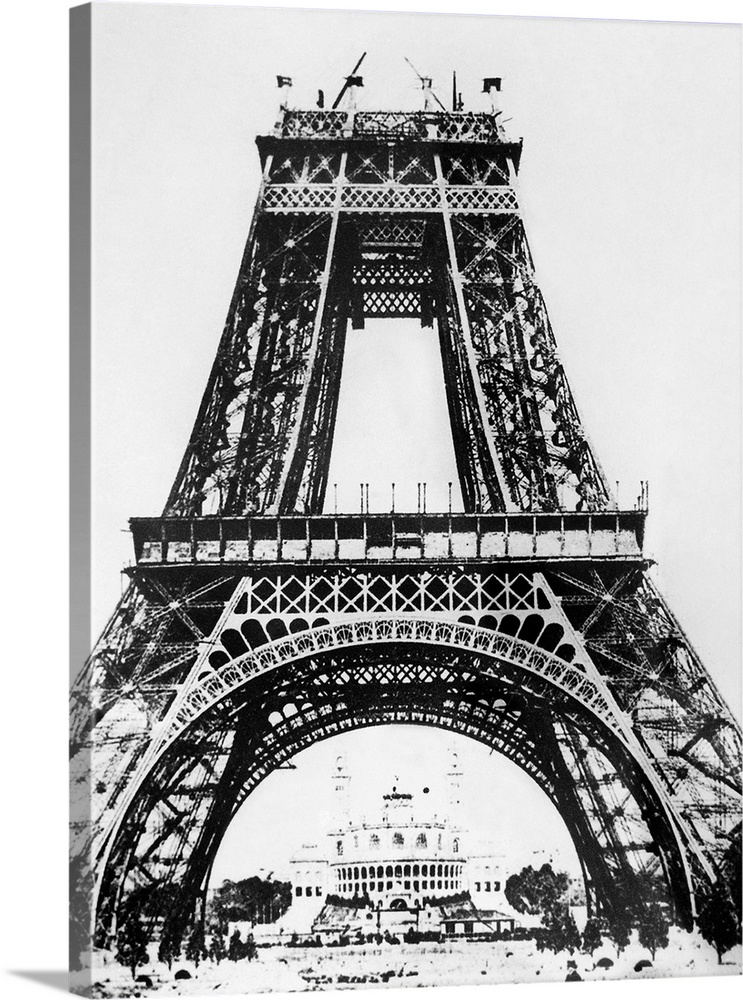 Building the Eiffel Tower on the Champ de Mars in Paris, France, for the Universal Exposition of 1889. The Palais de Troca...
