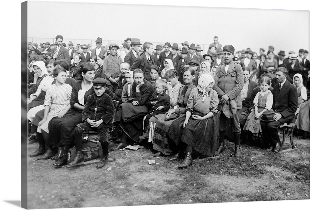 Immigrants on Ellis Island waiting for a boat.