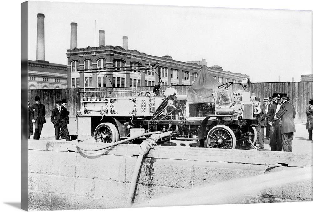 Fire engine of the Fire Department of New York being filled with water, c1911.