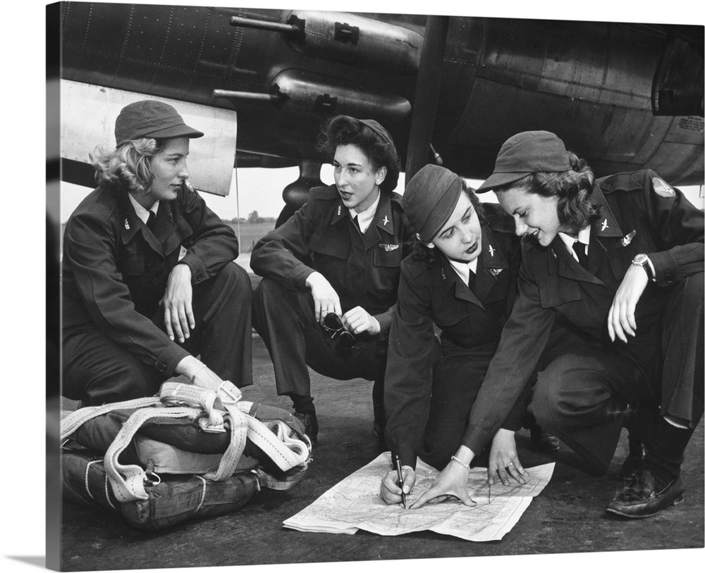 Four female pilots looking at a chart. Photograph, c1941.