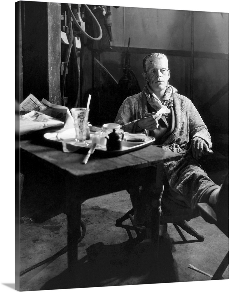 Boris Karloff still in makeup as the Monster, having lunch on the stage set of 'Frankenstein', 1931.