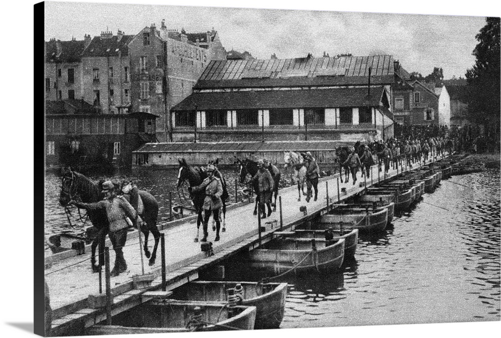 French cavalrymen leading their horses over a pontoon bridge in pursuit of the retreating German army after the First or S...