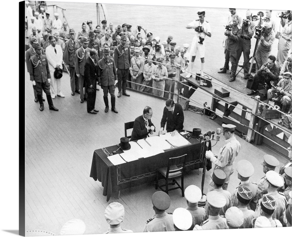 General Douglas MacArthur pauses at the microphone as Japanese Foreign Minister Mamoru Shigemitsu reaches for his pen to s...