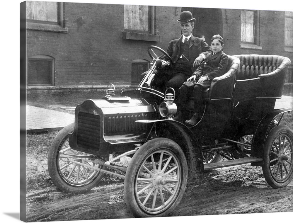 with his son Edsel in a 1905 Model F Ford in front of their home on Hendrie Avenue in Detroit.