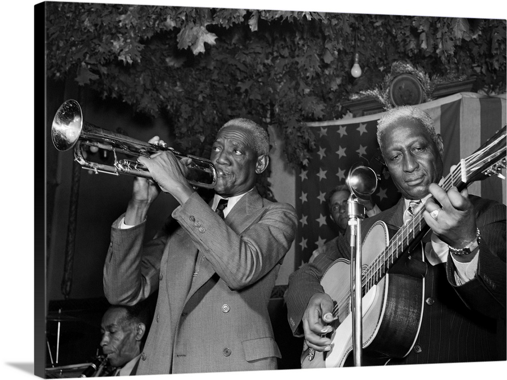 (1889-1949). Known as 'Lead Belly'. American folk musician. Performing with Bunk Johnson at the Stuyvesant Casino in New Y...