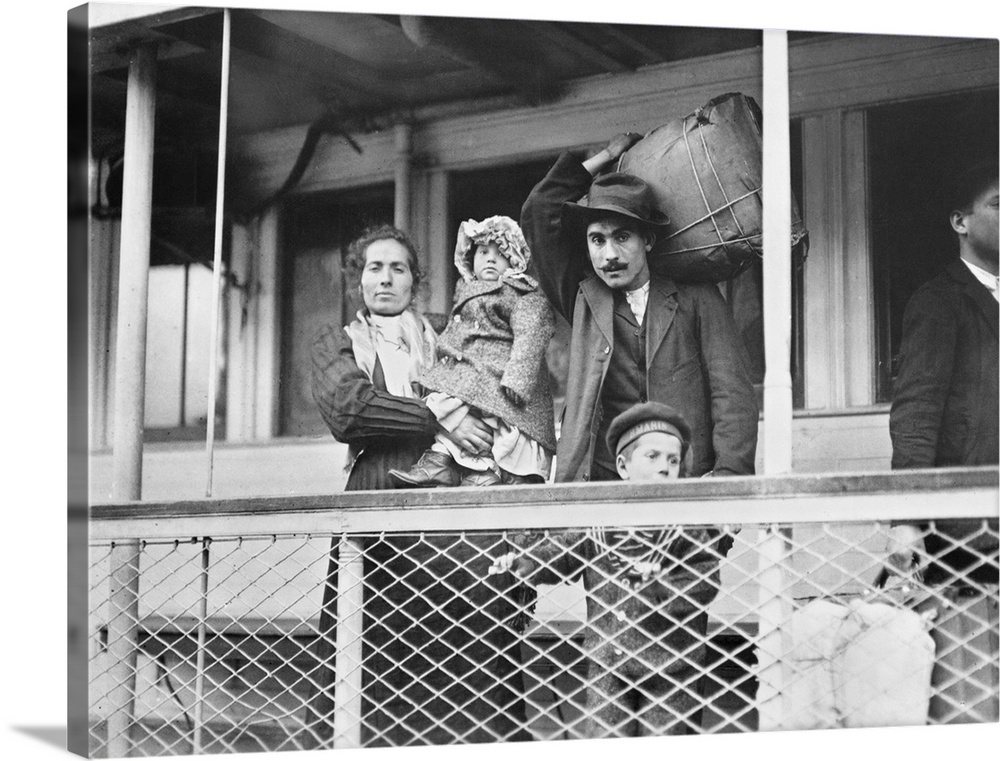 A family of Italian immigrants on board the Ellis Island ferry to Manhattan. Photograph by Lewis Hine, c1905.