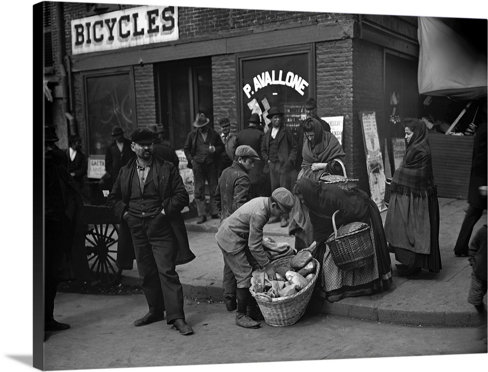Italian peddlers selling bread on Mulberry Street in New York City. Photograph, c1900.