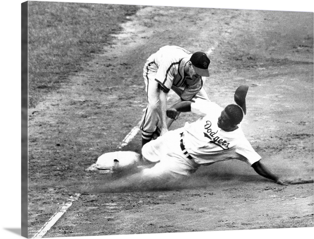 John Roosevelt Robinson, known as Jackie. American baseball player. As a member of the Brooklyn Dodgers, being tagged out ...