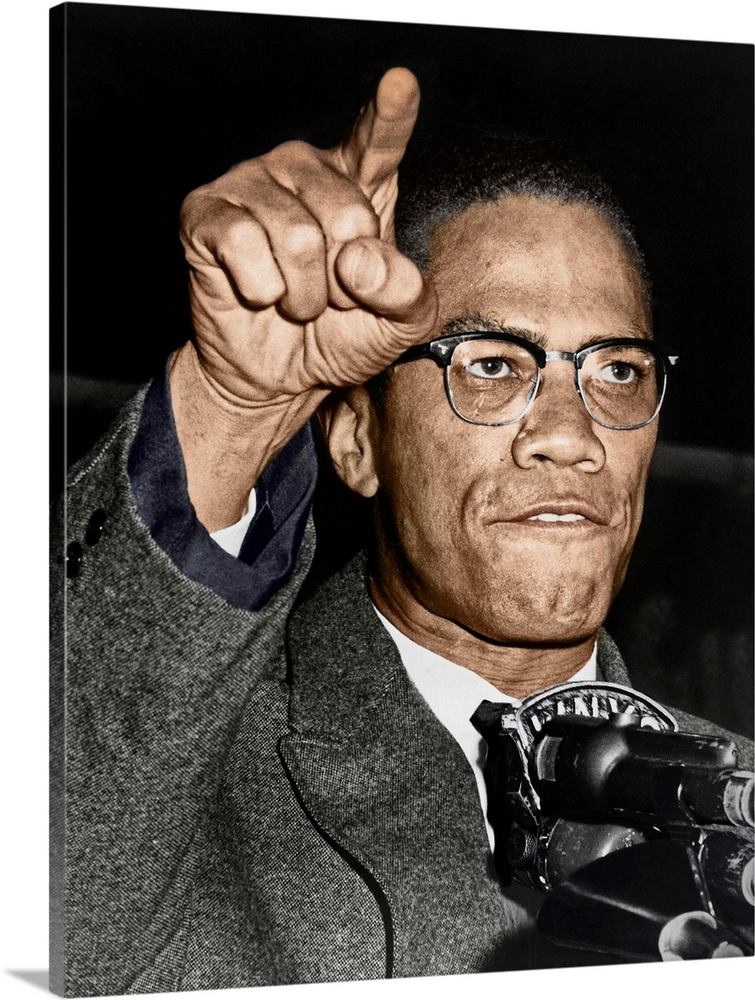 MALCOLM X (1925-1965). Born Malcolm Little. American religious and political leader. Photographed while giving a speech at...
