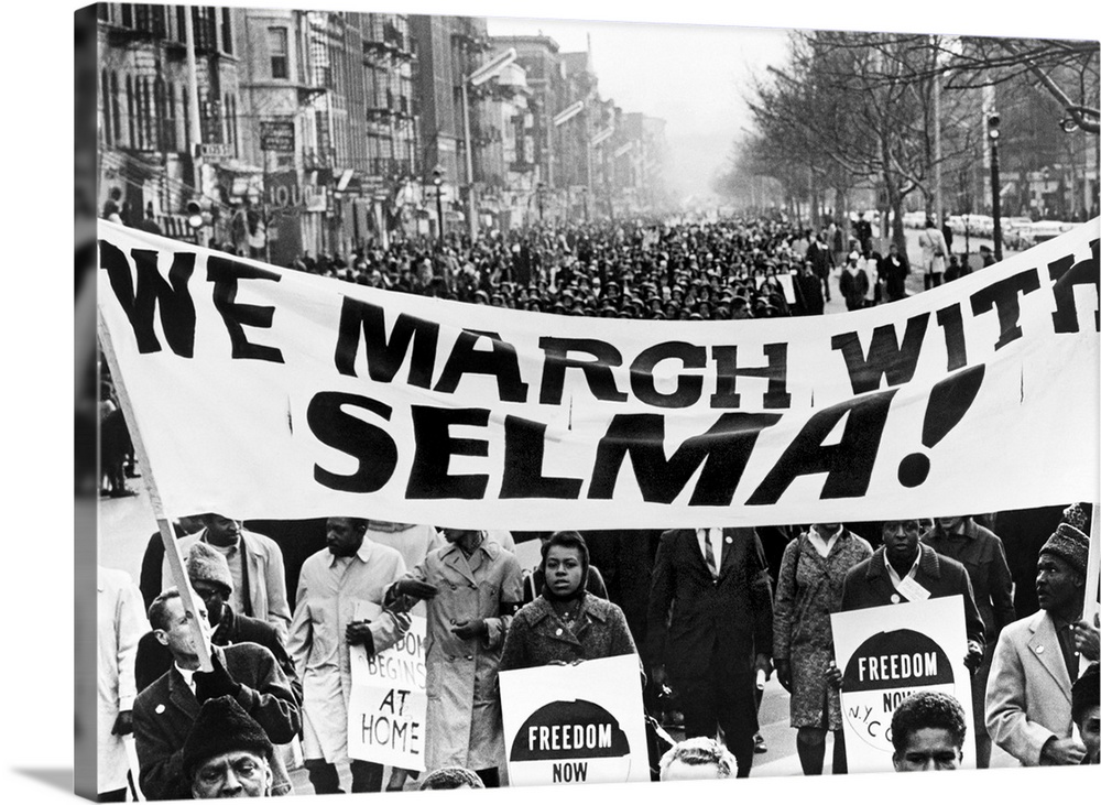 Marchers in Harlem, New York City, carrying banners in support of the Selma to Montgomery marchers. Photograph by Stanley ...